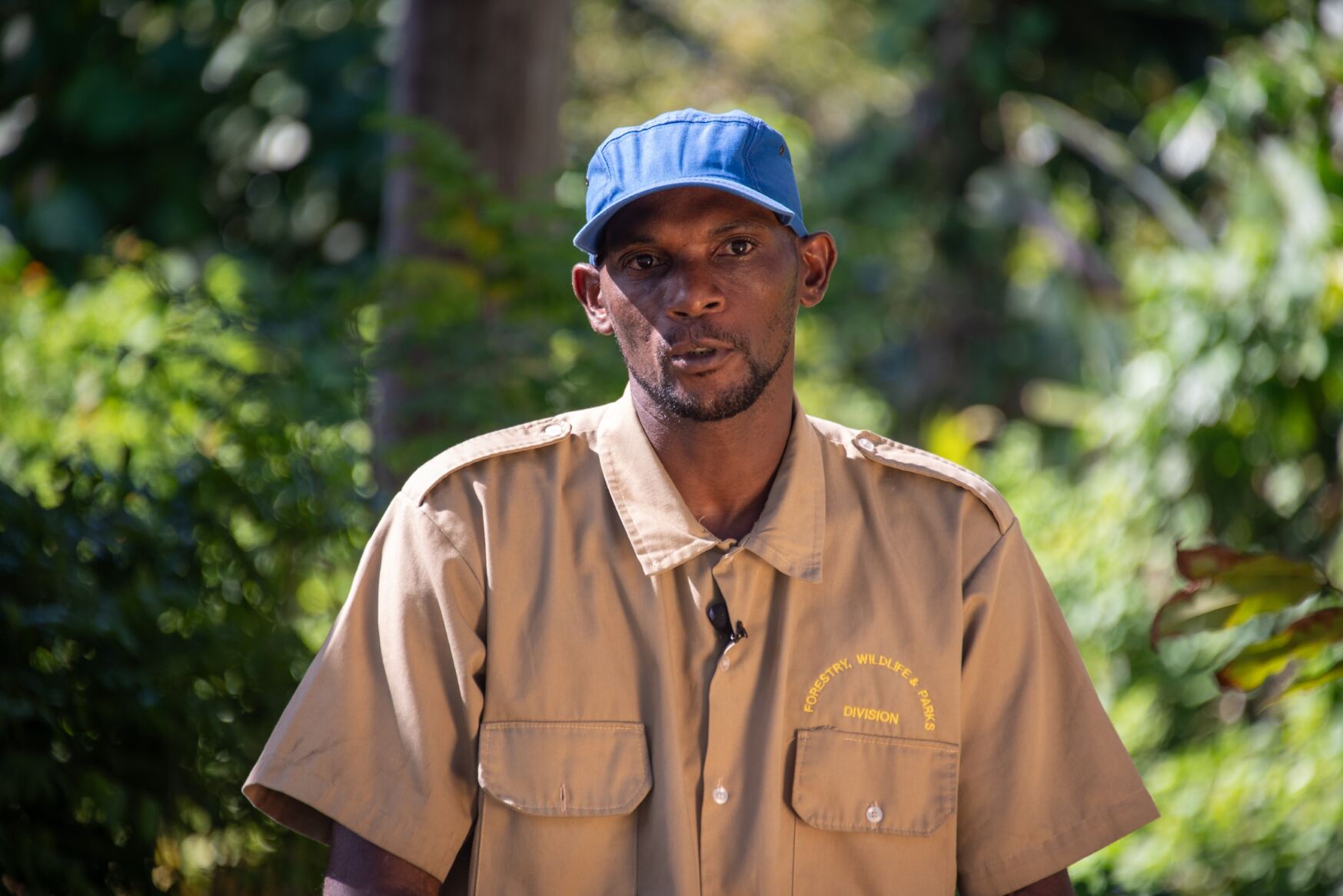 Thumbnail image of Dominica's Forestry Service Bradley Guy poses in a new nursery building made possible by CIF funding