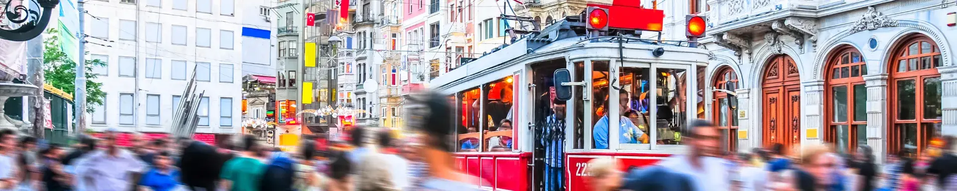 Busy road with people and tram