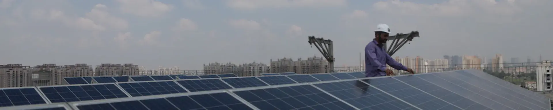 A man with solar panels on the roof