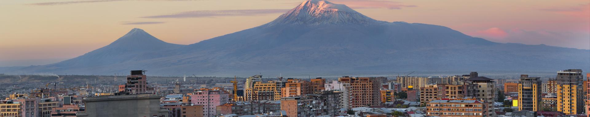 City in Armenia with mountain in background