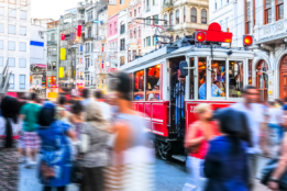 Busy road with people and tram