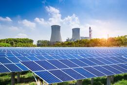 Solar panels in front of retired coal plants 